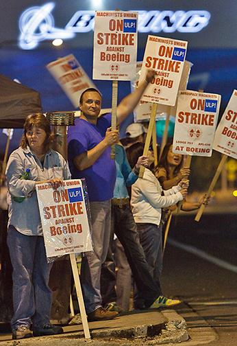 Striking Boeing workers on the picket line outside the Everett, Wash., factory.