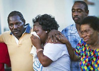 Parishioners at the Emanuel AME church mourn the victims of the massacre