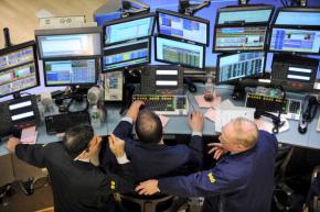 Traders watch the ups and downs of the futures markets