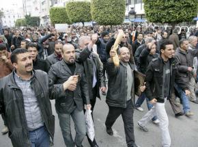 Tunisians march in Tunis for bread and an end to the reign of a dictator