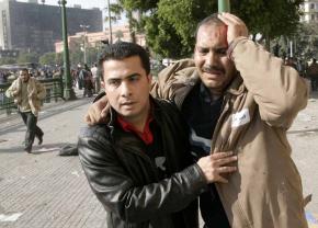 A protester wounded by pro-Mubarak thugs who charged the crowds in Tahrir Square