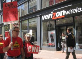 Supporters of Verizon workers picket outside a Verizon Wireless store