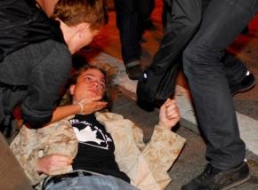 Scott Olsen lies in the street after being wounded by Oakland police