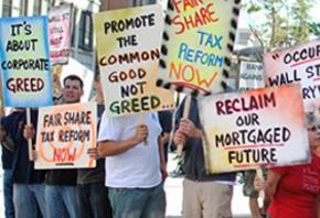 Supporters of Occupy Rochester rally against corporate greed and foreclosures