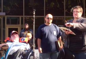 Raul Carranza (left) speaks to an Occupy San Diego rally