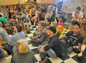 Protesters hold a discussion while sitting in at the California state Capitol building
