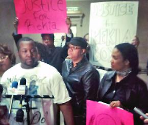Martinez Sutton, Rekia Boyd's brother, speaks with protesters outside Mayor Emanuel's office