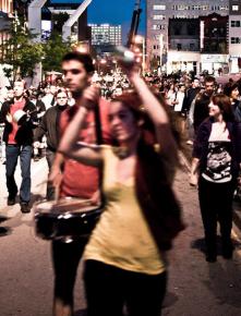 Students join in a caserole march through Montreal, banging on pots and pans