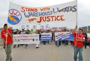 Hundreds of union and social justice activists march in solidarity with warehouse workers on strike against Wal-Mart