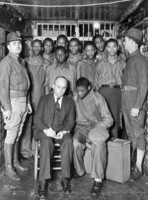 The Scottsboro Boys in prison, speaking with a lawyer