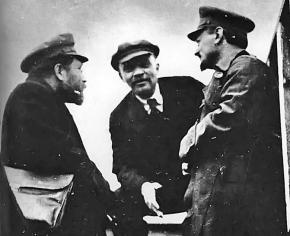 V.I. Lenin (center) and Leon Trotsky (right) in discussions after the Russian Revolution