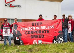 Strikers and supporters picket outside a Verizon Wireless store
