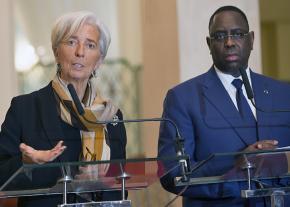 Christine Lagarde of the International Monetary Fund (left) speaks alongside Senegalese President Macky Sall