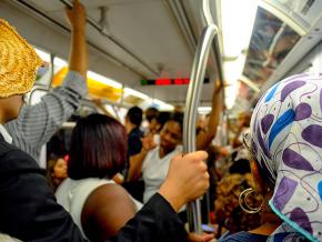 Commuters ride the New York City subway