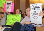 Activists with the Facing Urban Shield Action Network protest during a hearing in Oakland (IndyBay) Activists with the Facing Urban Shield Action Network protest during a hearing in Oakland (IndyBay)