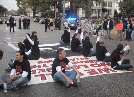 Activists block traffic in a protest against Alabama's anti-immigrant law HB 56