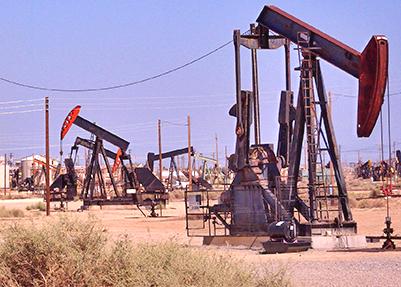 Oil derricks cover the landscape in California
