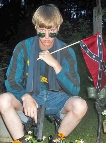 Dylann Roof poses with a Confederate flag and handgun