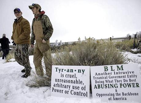 Militia members near the entrance to the Malheur National Wildlife Refuge Center