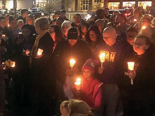 Mourners hold a vigil for Vicki Lee Jones and Maurice E. Stallard in Jeffersontown, Kentucky