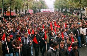 A mass protest against the Karamanlis government winds its way through the streets of Athens
