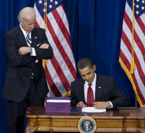 Barack Obama signs the economic stimulus bill