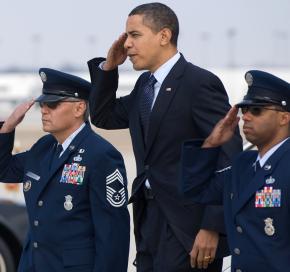 Barack Obama salutes as he exits Air Force One