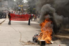 Protesters march through Tegucigalpa the day after Zelaya's return