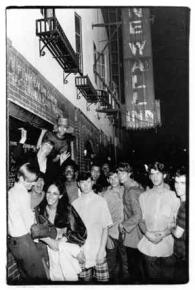 People gather outside the Stonewall Inn during several days of rioting against police harassment
