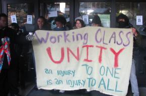 Students defend the doors to the occupied business administration building at SFSU in December
