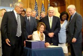 Democrats Barney Frank, Nancy Pelosi and Chris Dodd at a signing ceremony for the financial reform bill