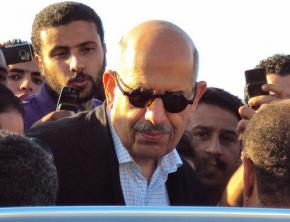 Mohamed ElBaradei surrounded by reporters in Cairo