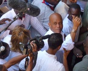 Haitian Presdent Michel Martelly surrounded by the media