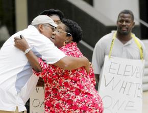 Community members celebrate news of the convictions outside the courthouse