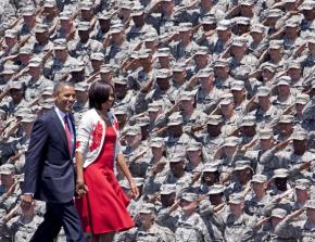 Barack and Michelle Obama are greeted by troops during a visit to Fort Stewart