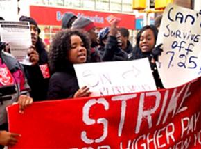 Wendy's employees rally outside their workplace during the November 29 day of action