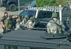 Gabe Camacho took this photo of militarized police besieging the house across from him