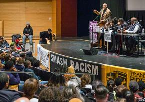Hundreds came to a forum on #BlackLivesMatter in Seattle to hear speakers like John Carlos (at microphone)