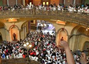Protesters pack the Illinois Capitol building to protest Gov. Bruce Rauner's budget cuts