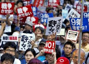 Mass protests outside Japan's parliament against changes to the peace clause of the Constitution