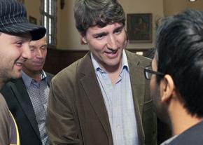 Canadian Prime Minister Justin Trudeau (center) speaks with students in Ontario