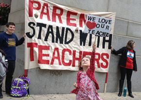 Parents and students show their support for Chicago's teachers outside City Hall