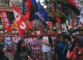 Workers in the streets of Manila to protest the hero's burial of ex-dictator Ferdinand Marcos