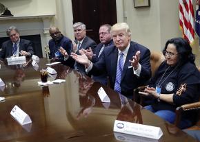 Donald Trump and White House strategist Steve Bannon (at left) meet with a handful of labor leaders