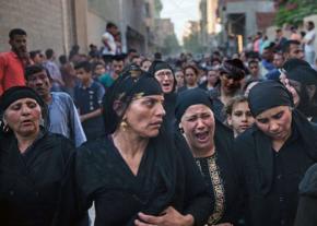 Family and friends mourn the victims of a deadly attack on Coptic Christians in Egypt