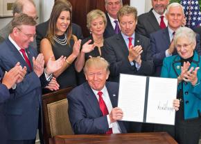 Donald Trump signs an executive order on health care