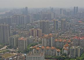 Smog covers the skyline of a working class district in Guangzhou, China