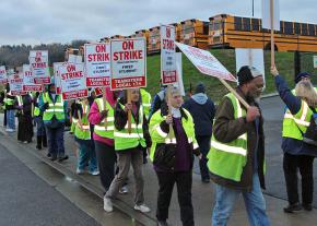 Striking school bus drivers walk the picket line in Seattle, Washington