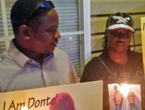 Family members hold a vigil for A'Donte Washington in Millbrook, Alabama