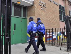 Armed police on patrol at a public elementary school in New York City
